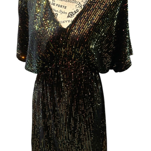Black iridescent mini dress with v-neck design and dolman sleeves. - Picture 4 of 6
